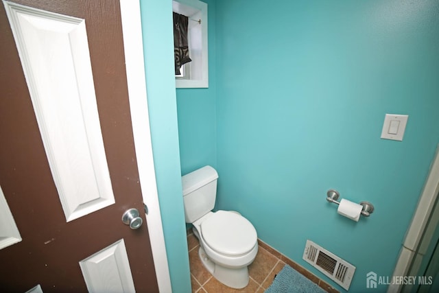 bathroom featuring tile patterned floors and toilet