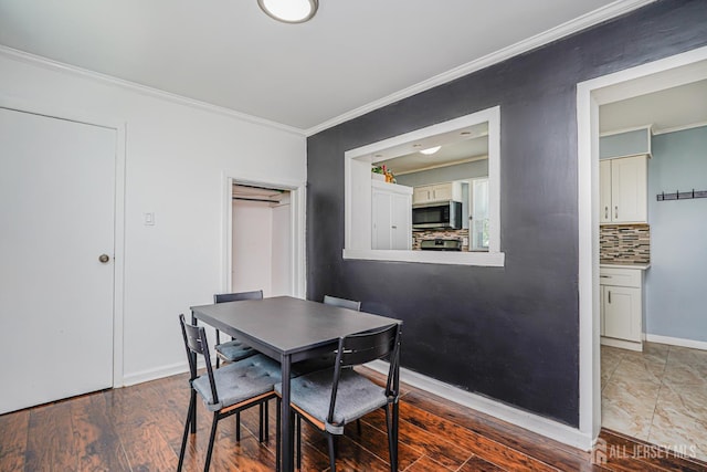 61 Trinity Ln, Woodbridge Proper, NJ 07095 - dining space featuring ornamental molding and wood finished floors