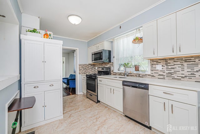 61 Trinity Ln, Woodbridge Proper, NJ 07095 - kitchen with appliances with stainless steel finishes, ornamental molding, backsplash, light countertops, and light marble finish flooring