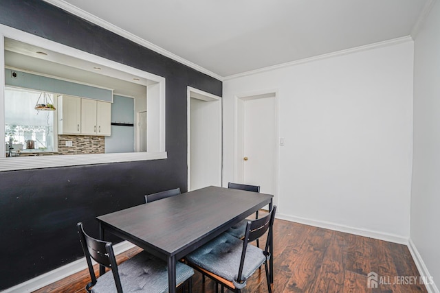 61 Trinity Ln, Woodbridge Proper, NJ 07095 - dining space featuring ornamental molding and dark wood finished floors
