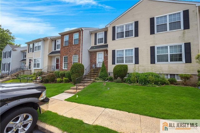 20 Karwatt Ct, Sayreville, NJ 08872 - townhome / multi-family property with a front yard and a residential view