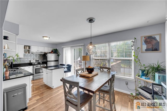 20 Karwatt Ct, Sayreville, NJ 08872 - dining space featuring healthy amount of natural light and light wood-style floors