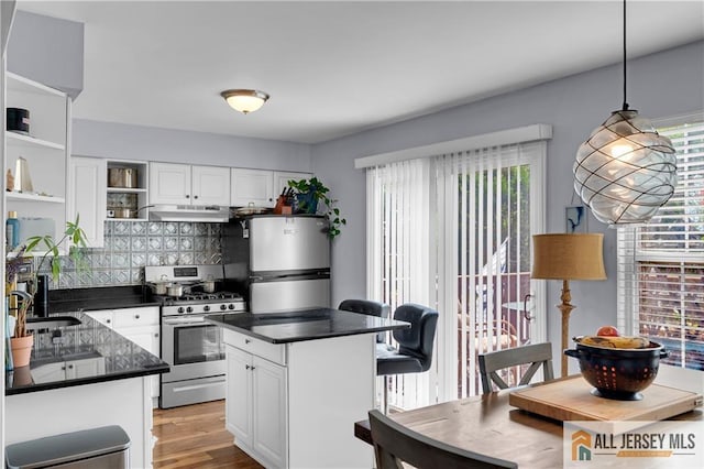 20 Karwatt Ct, Sayreville, NJ 08872 - kitchen with appliances with stainless steel finishes, under cabinet range hood, open shelves, dark countertops, and white cabinets