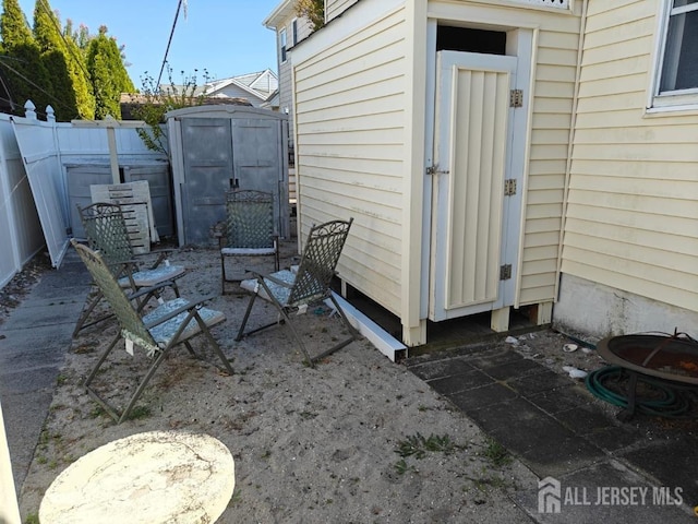 view of patio / terrace featuring a shed