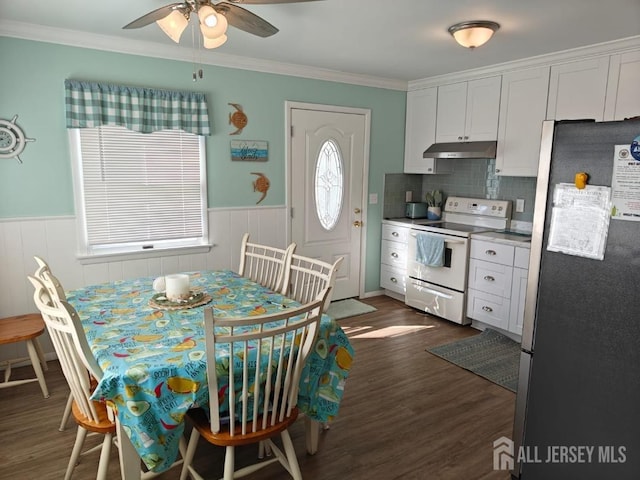 kitchen with white cabinetry, backsplash, white range with electric stovetop, dark hardwood / wood-style flooring, and stainless steel fridge