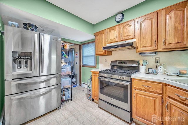 30 Falmouth Rd, Iselin, NJ 08830 - kitchen featuring appliances with stainless steel finishes, under cabinet range hood, light countertops, and baseboards