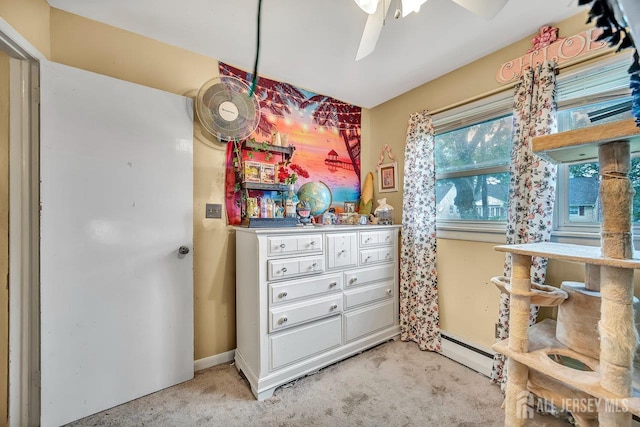 30 Falmouth Rd, Iselin, NJ 08830 - bedroom featuring light carpet, a baseboard heating unit, baseboards, and a ceiling fan