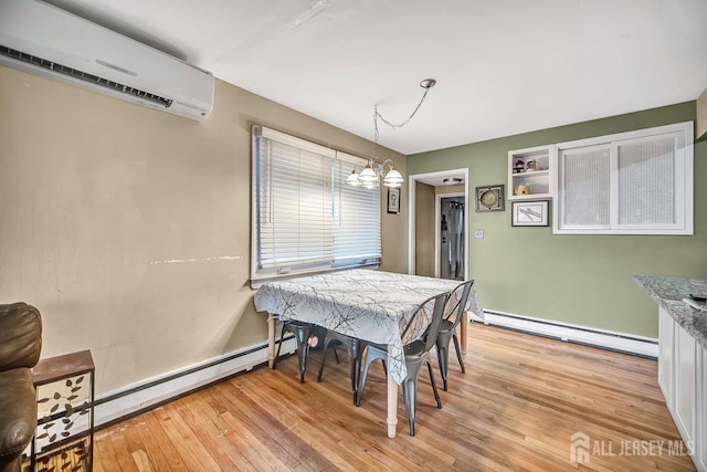30 Falmouth Rd, Iselin, NJ 08830 - dining space featuring a baseboard heating unit, an AC wall unit, a chandelier, and light wood-type flooring