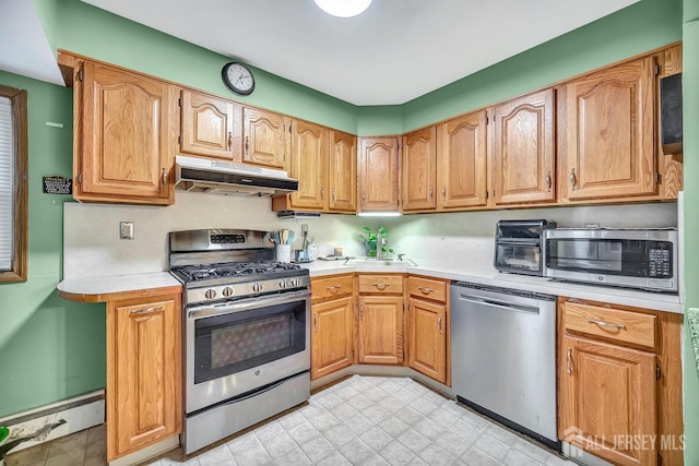30 Falmouth Rd, Iselin, NJ 08830 - kitchen with appliances with stainless steel finishes, under cabinet range hood, and light countertops