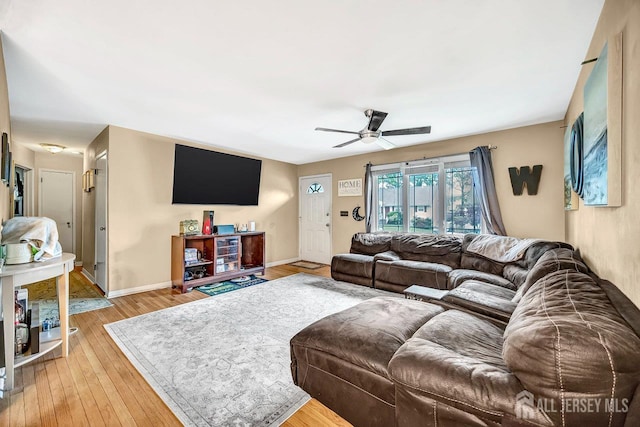 30 Falmouth Rd, Iselin, NJ 08830 - living area with ceiling fan, light wood finished floors, and baseboards