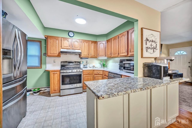 30 Falmouth Rd, Iselin, NJ 08830 - kitchen with stainless steel appliances, under cabinet range hood, and a peninsula
