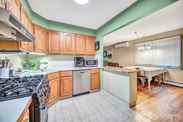 30 Falmouth Rd, Iselin, NJ 08830 - kitchen with stainless steel appliances, under cabinet range hood, a sink, and light countertops