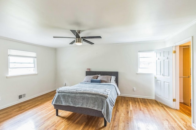 45 S Brook Dr, Milltown, NJ 08850 - bedroom featuring multiple windows, crown molding, light wood-type flooring, and ceiling fan