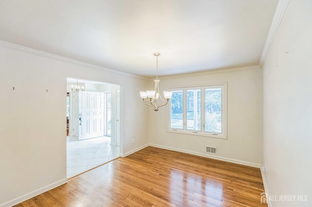45 S Brook Dr, Milltown, NJ 08850 - spare room with a chandelier, light wood-style flooring, and ornamental molding