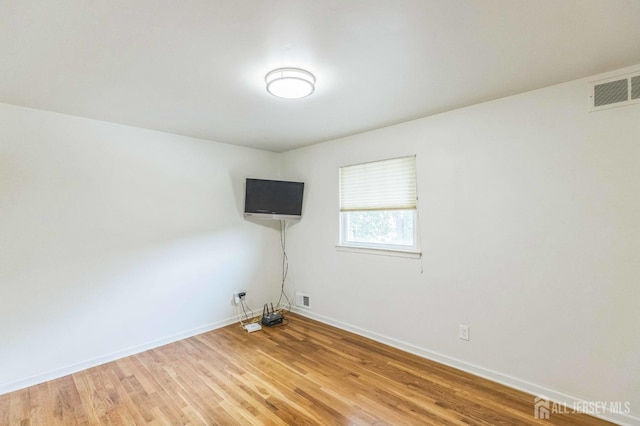 45 S Brook Dr, Milltown, NJ 08850 - spare room featuring light wood-style floors and baseboards
