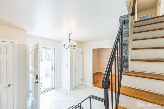 45 S Brook Dr, Milltown, NJ 08850 - foyer entrance featuring stairway, a chandelier, and light tile patterned floors