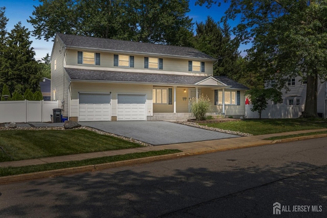 45 S Brook Dr, Milltown, NJ 08850 - traditional-style home with asphalt driveway, a garage, and a porch