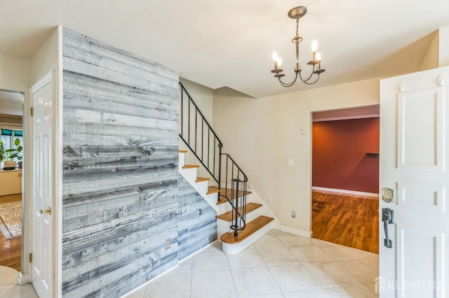 45 S Brook Dr, Milltown, NJ 08850 - stairway featuring tile patterned floors and a chandelier