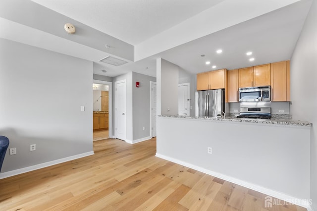 20 Livingston Ave Unit 905, New Brunswick, NJ 08901 - kitchen with stainless steel appliances, light wood-style floors, a peninsula, recessed lighting, and light stone counters