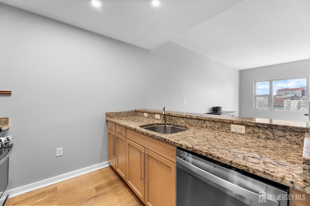 20 Livingston Ave Unit 905, New Brunswick, NJ 08901 - kitchen featuring dishwasher, light stone counters, light wood finished floors, a peninsula, and recessed lighting