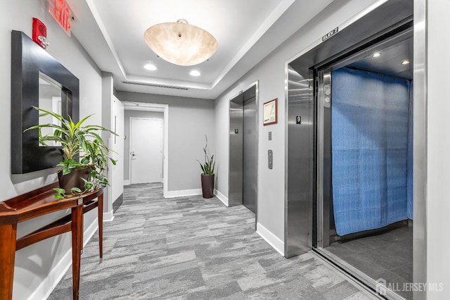 20 Livingston Ave Unit 905, New Brunswick, NJ 08901 - corridor featuring elevator, recessed lighting, a tray ceiling, and carpet