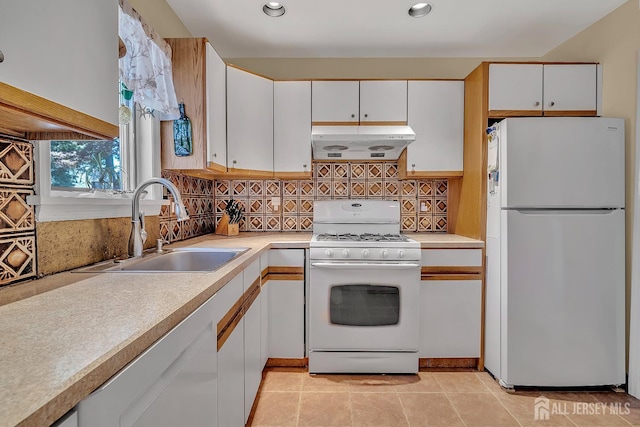 436 2nd St, Dunellen, NJ 08812 - kitchen featuring white appliances, range hood, white cabinetry, backsplash, and light countertops