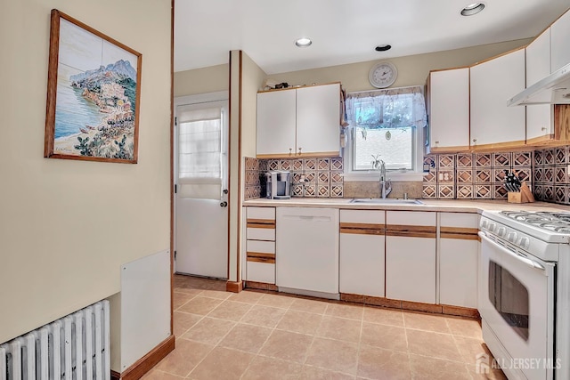 436 2nd St, Dunellen, NJ 08812 - kitchen featuring white appliances, radiator heating unit, light countertops, decorative backsplash, and white cabinetry