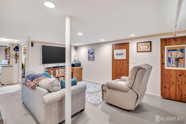 436 2nd St, Dunellen, NJ 08812 - living room with finished concrete flooring, recessed lighting, and crown molding