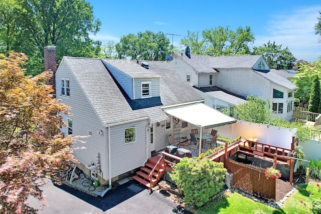 436 2nd St, Dunellen, NJ 08812 - back of property with roof with shingles, a deck, and a chimney