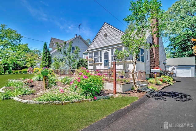 436 2nd St, Dunellen, NJ 08812 - bungalow with a garage, a front lawn, and a chimney