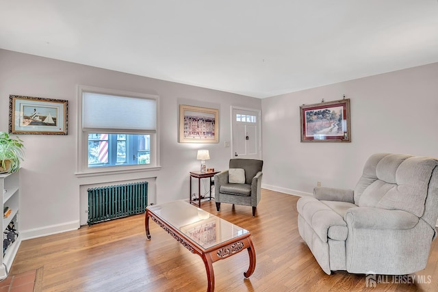 436 2nd St, Dunellen, NJ 08812 - living area featuring radiator heating unit, baseboards, and wood finished floors