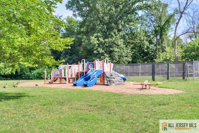 view of playground with a lawn