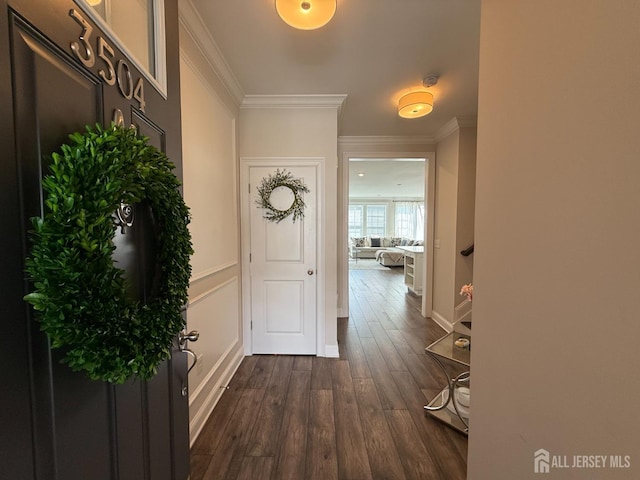 3504 Charleston Dr, Monroe, NJ 08831 - entrance foyer with dark wood-style floors, crown molding, and baseboards