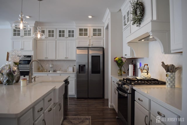 3504 Charleston Dr, Monroe, NJ 08831 - kitchen with stainless steel fridge with ice dispenser, gas range, light countertops, dark wood-style flooring, and backsplash