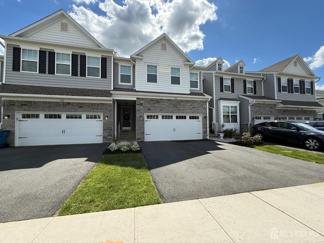 3504 Charleston Dr, Monroe, NJ 08831 - townhome / multi-family property featuring asphalt driveway, a garage, and stone siding