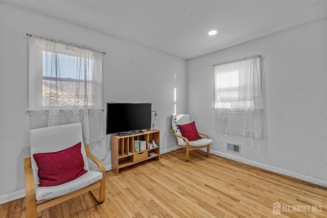 sitting room with light wood-type flooring