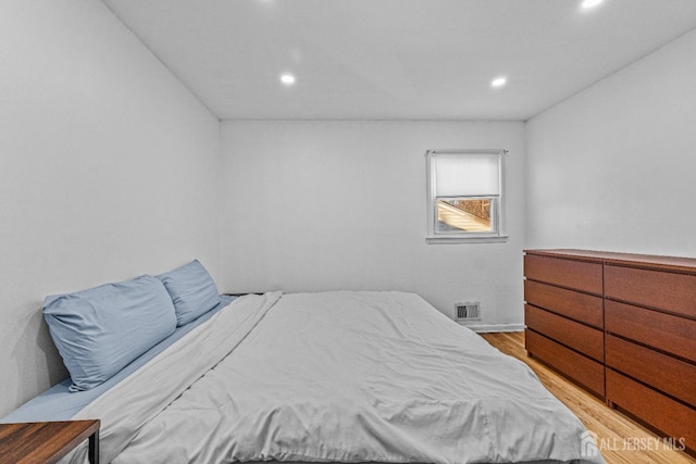 bedroom with light hardwood / wood-style floors