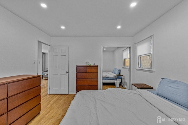 bedroom with a closet and light wood-type flooring