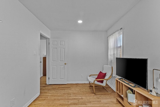 living area with light hardwood / wood-style floors