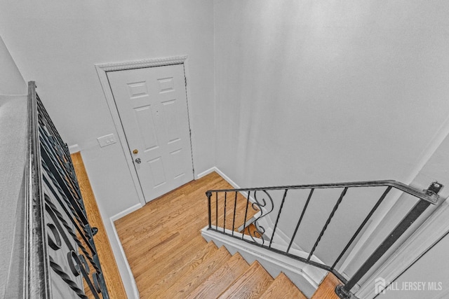 stairs with wood-type flooring