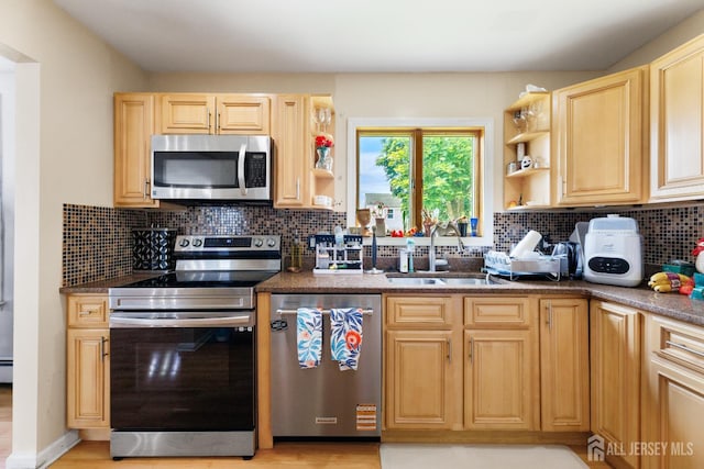 336 S Main St, Milltown, NJ 08850 - kitchen with stainless steel appliances, open shelves, light brown cabinetry, and tasteful backsplash