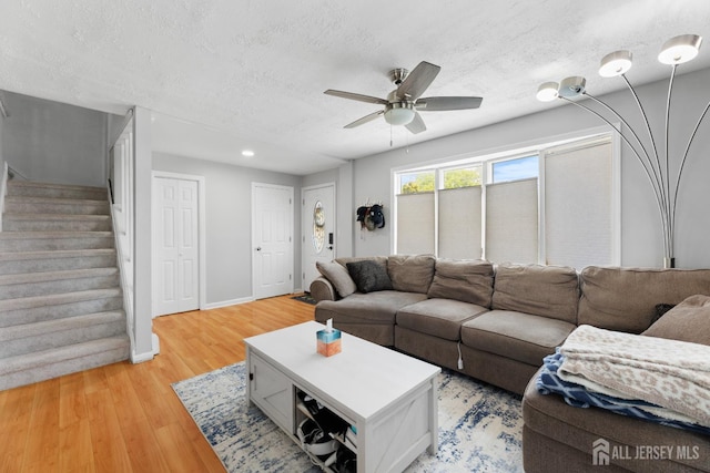 336 S Main St, Milltown, NJ 08850 - living room with a textured ceiling, light wood finished floors, stairway, a ceiling fan, and recessed lighting