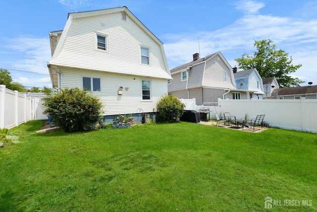 336 S Main St, Milltown, NJ 08850 - back of house featuring a gambrel roof, a fenced backyard, and a patio