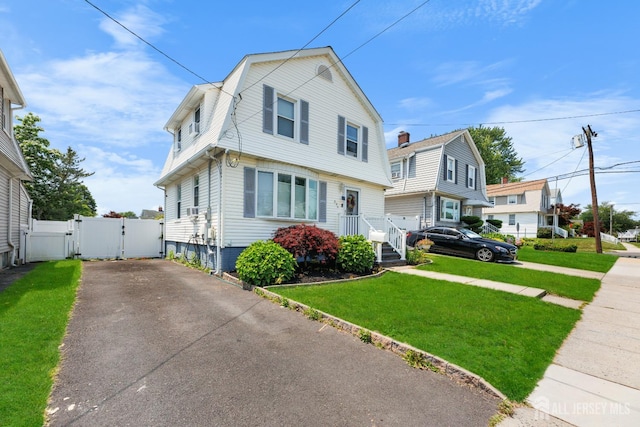 336 S Main St, Milltown, NJ 08850 - colonial inspired home featuring a gate, a gambrel roof, and driveway