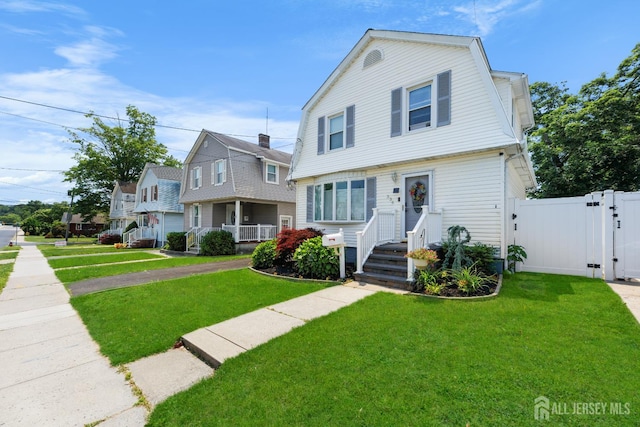 336 S Main St, Milltown, NJ 08850 - dutch colonial with a gate, a gambrel roof, and a residential view