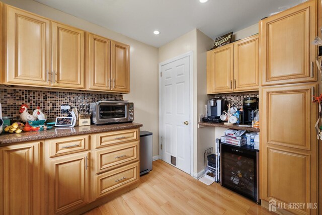336 S Main St, Milltown, NJ 08850 - kitchen with decorative backsplash, light wood-style floors, recessed lighting, light brown cabinetry, and beverage cooler