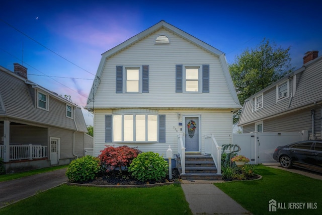 336 S Main St, Milltown, NJ 08850 - dutch colonial with a gambrel roof and a gate