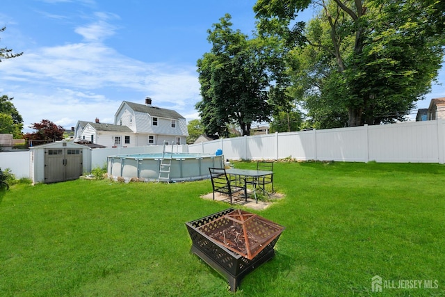 336 S Main St, Milltown, NJ 08850 - view of yard with an outdoor fire pit and a shed