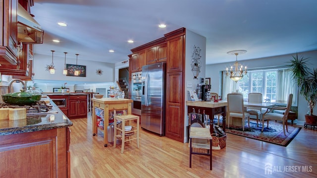 3 Feathertree Ct, Howell, NJ 07731 - kitchen featuring stainless steel appliances, light wood-type flooring, decorative light fixtures, a chandelier, and recessed lighting