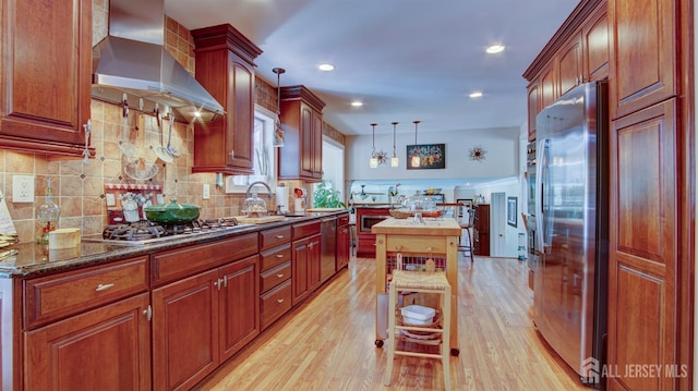 3 Feathertree Ct, Howell, NJ 07731 - kitchen with ventilation hood, stainless steel appliances, light wood-style flooring, backsplash, and a center island